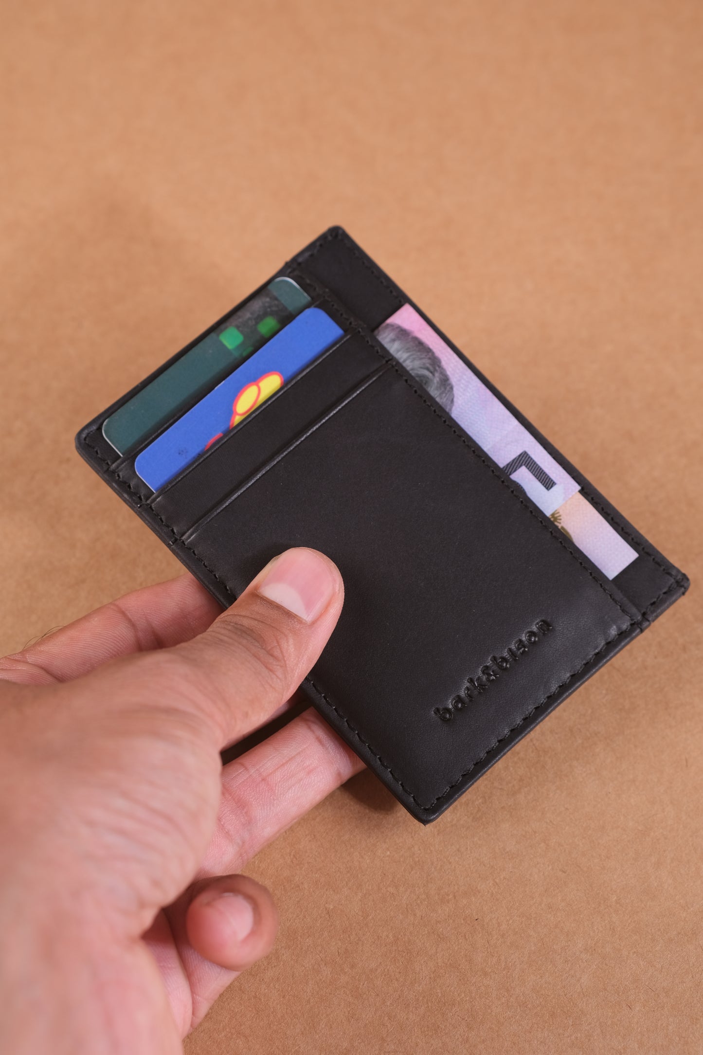 Sleek black leather cardholder online