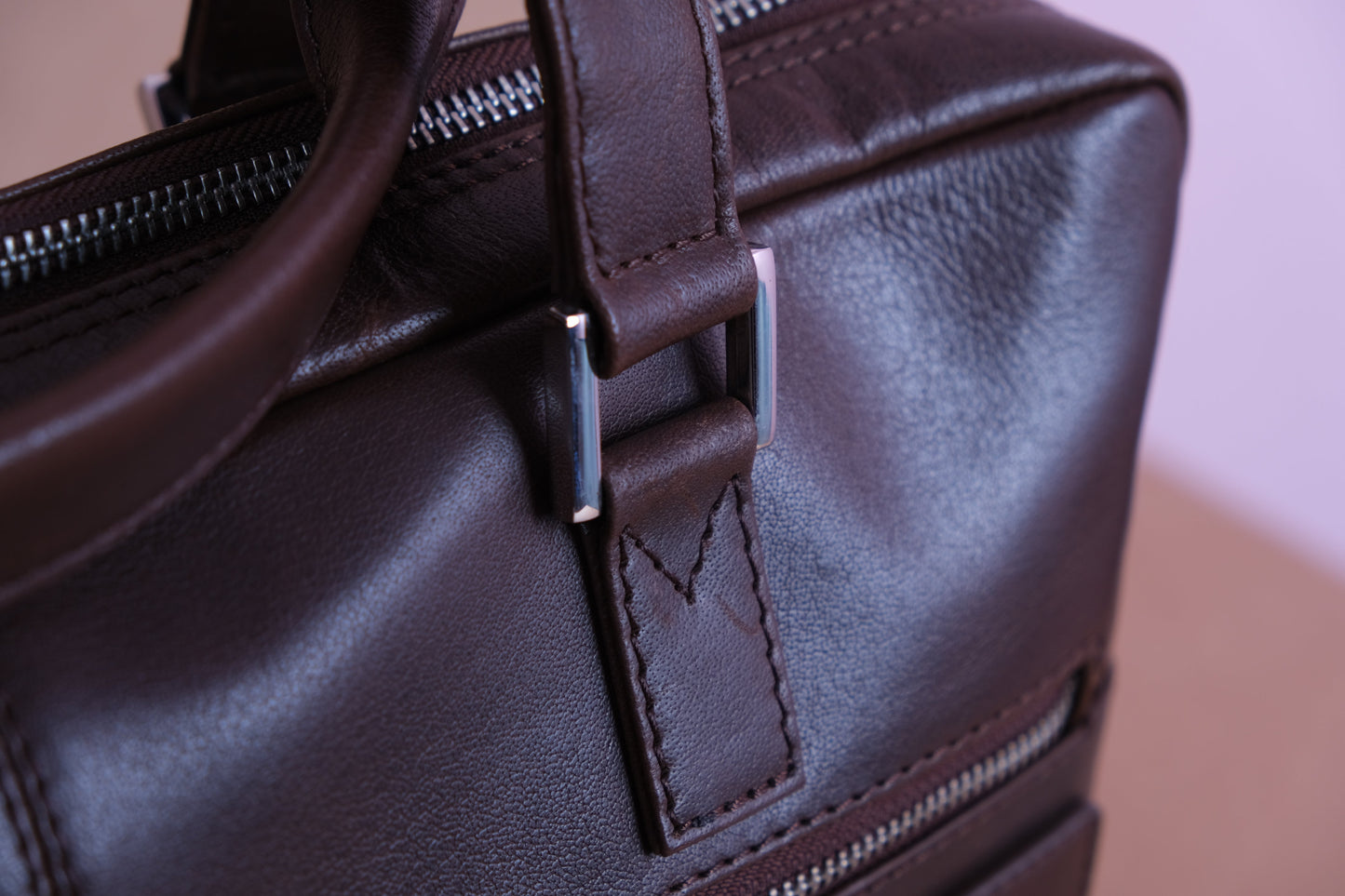 close up of leather dark brown handbag